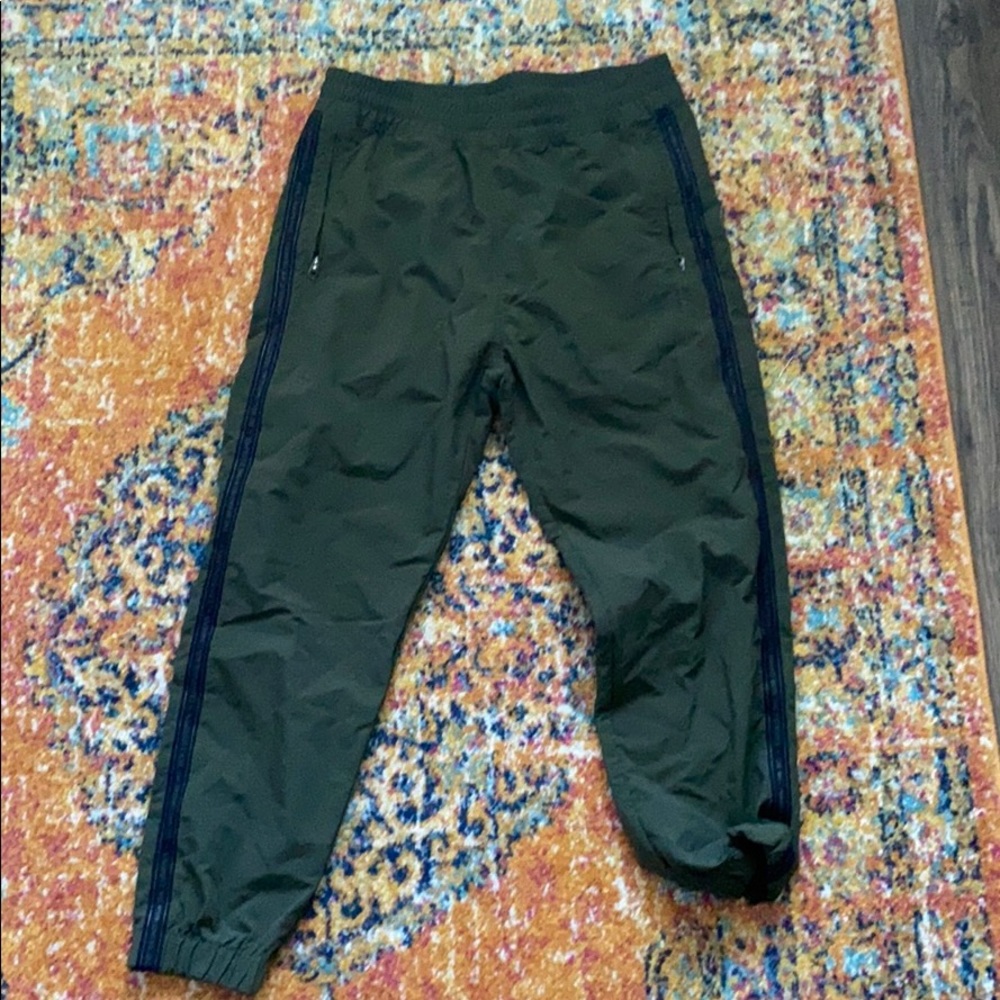 Green adidas track pants